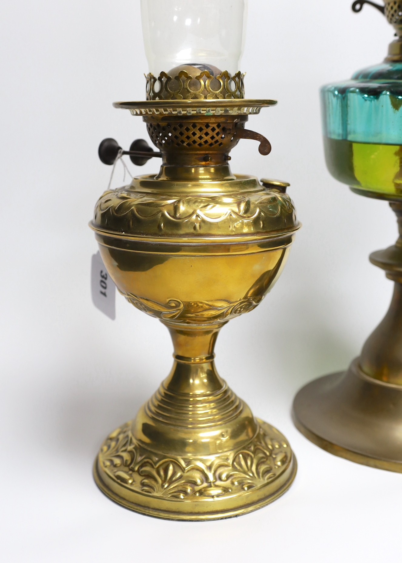 A Victorian brass oil lamp and one other lamp (2)